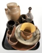 A group of Scandinavian stoneware items, including lidded barrel with tap, jugs, candle holder,