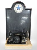 A Singer electric sewing machine and a Newcastle Breweries pub advertising sign