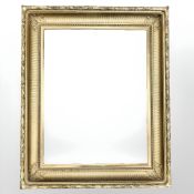 A gilt composition frame with decorative mouldings, to fit a stretcher of 70.5 cm x 55 cm.