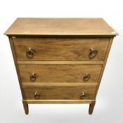 A reproduction walnut three drawer low chest, 54 cm x 27 cm 68 cm.