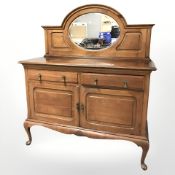 A late Victorian walnut mirrorback sideboard, 136 cm x 54 cm x 159 cm.