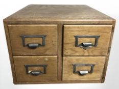 An early 20th century oak four drawer desktop index chest, width 40 cm.