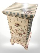 A small painted three drawer chest,