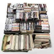 A large quantity of DVDs, vinyl records and 45 singles.