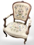 A continental carved beech salon armchair in tapestry fabric
