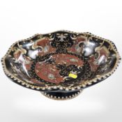 A decorative porcelain pedestal bowl,