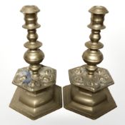 A pair of continental heavy cast brass hexagonal candlesticks, height 29 cm.