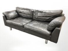 A late 20th century Danish black leather three seater settee on chrome legs,