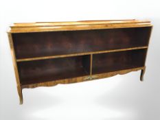 A 20th century continental walnut and satinwood inlaid low bookcase, 161 cm x 31 cm x 80 cm.