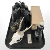 A pair of Crown 16x50 binoculars, Tasco 7x50mm binoculars, a further antique pair of binoculars,