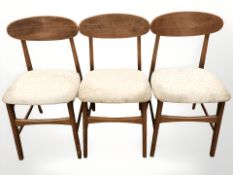 A set of three 20th century teak dining chairs