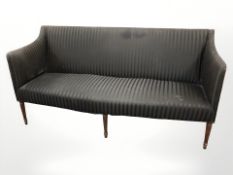 A mid 20th century continental three seater salon settee in striped black fabric,