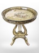 A reproduction occasional tray table on lyre shaped support, height 73 cm.