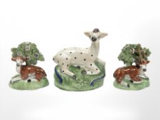A pair of Staffordshire cream ware figures of recumbent deer, circa 1800,