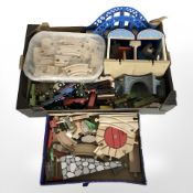 A group of Thomas the Tank Engine and other model trains, wooden track, buildings, etc.