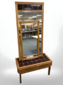 A Danish oak tile inset coffee table, with matching mirror and a further oak framed mirror.