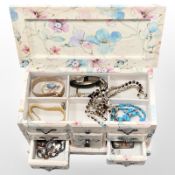 A multi drawer jewellery box containing costume jewellery