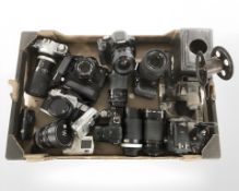 A group of vintage/modern cameras, including Canon EOS500D, Canon A1, Fujifilm Finepix S2980,
