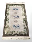 A Chinese rug, 170 cm x 92 cm.