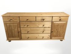 A contemporary pine sideboard,