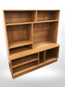 A Danish teak veneered open bookcase, 121 cm x 40 cm x 131 cm.