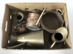 A group of brass and copper wares, including jugs, miniature coal bucket, etc.