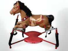 A modern childs ride-on rocking horse.