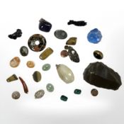 A group of polished gemstones and other items,
