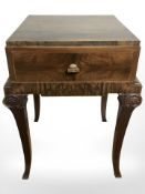 A continental burr walnut single drawer bedside stand,