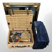 A gilt and ebonised mirror, together with a wicker hamper containing barometer,