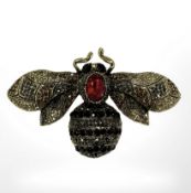A heavily encrusted oversized insect brooch,