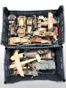 A collection of miniature wooden model cars and aircraft.
