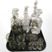 A group of crystal and pressed glass decanters, Holmegaard decanter with stopper,