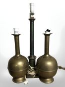 A pair of brass vases converted to table lamps and a further brass lamp, height 64 cm.
