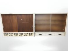 Two 20th century painted sliding door wall cabinets, each 102 cm wide.