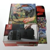 A Nintendo Switch in box, Nintendo Switch Ringfit Adventure,