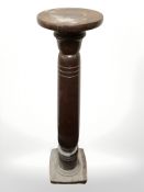 A turned beech torchere, height 111 cm.