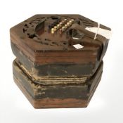 A 19th century Lachenal & Co concertina with fretwork ends.