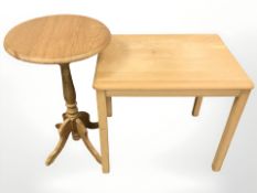An oak circular occasional table and a pine table, width 57 cm.