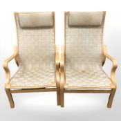A pair of Danish bentwood and canvas armchairs with head rests after a design by Finn Ostergaard