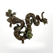 A heavilyy encrusted snake brooch on vine,