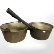Two cast iron handled brass pans and a further jam pan.
