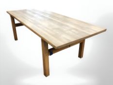 A Danish pine drop leaf extending dining table, 210 cm x 95 cm x 72 cm.