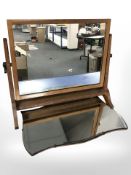 A frameless mirror and a dressing table mirror,