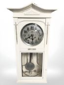 An early 20th century continental painted wall clock with silvered dial, height 89 cm.