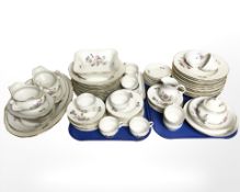 Approximately seventy five pieces of continental floral decorated tea and dinner porcelain.