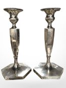 A pair of George V loaded silver candlesticks with matching removable sconces, Hawksworth,