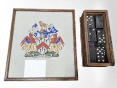 A set of dominoes in wooden box and a Grocer's Company crest painted in watercolours, in frame,