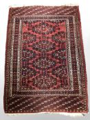 An Afghan rug of geometric design, 145 cm x 101 cm.