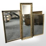 Four various reproduction gilt framed mirrors, largest 126 cm x 42 cm.